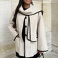 Elegant and versatile jacket with integrated scarf 